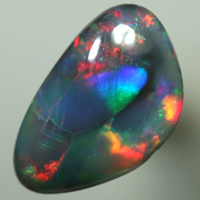 SOLID BLACK OPAL Bright red and turquoise rolling flashes